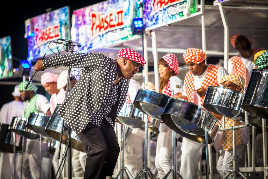 Len “Boogsie” Sharpe conducts Phase II's performance of his composition "Madd Music" at the 2016 Panorama finals in the Queen's Park Savannah. They placed 3rd. Photo by Maria Nunes