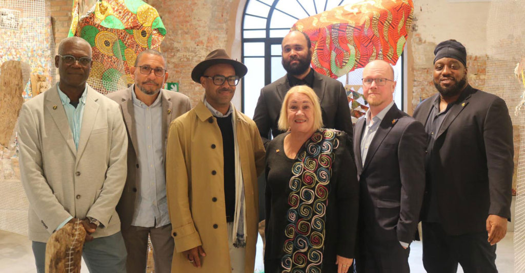 From left to right: Artists Oliver Benoit, Angus Martin, Billy Gerrard Frank, Samuel Ogilvie, Susan Mains, Asher Mains, and Ian Friday. Photo courtesy the Grenada National Pavilion