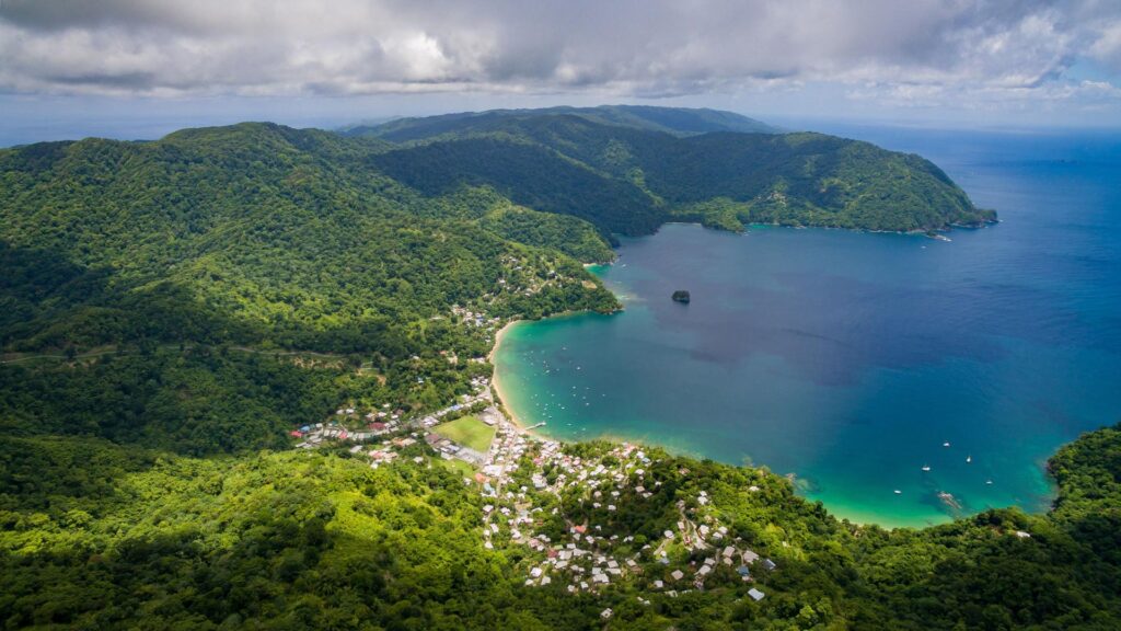 Boats on the beach at Pirate’s Bay, Tobago. Photo by RobertHarding/Alamy Stock Photo