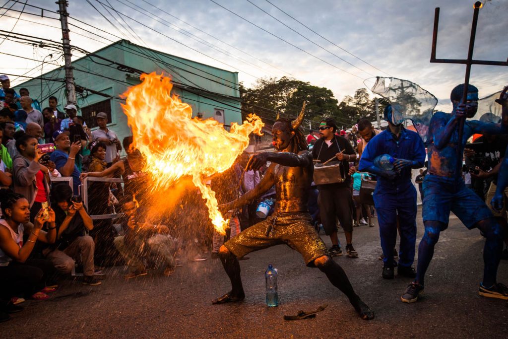 A Jab Molassie breathes fire in the streets of Port of Spain, Trinidad. Photo by Jason Audain