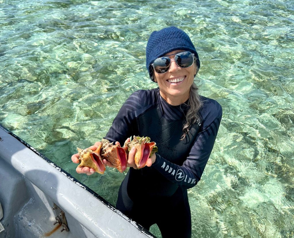 Dr Megan Davis observing juvenile conch habitats in the seagrass beds of East End, Grand Bahama. Photo by Antony Johns, courtesy Florida Atlantic University